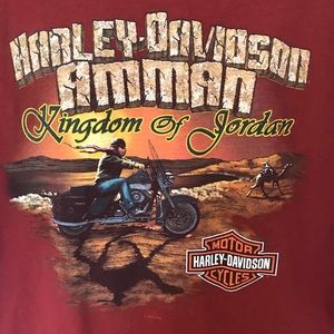 Short sleeve rust colored Harley Davidson shirt.